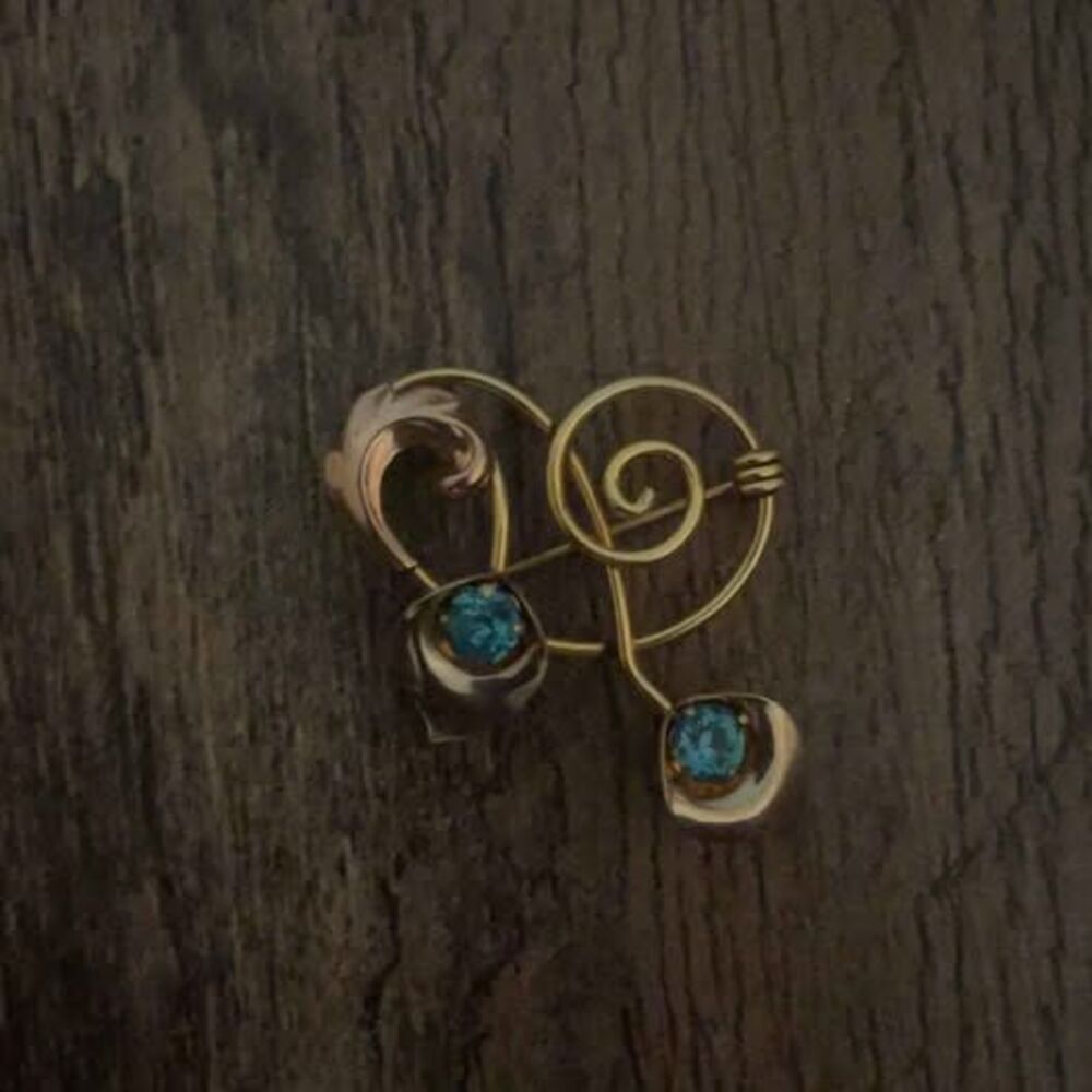 Vintage Gold-Tone Spiral Brooch with Blue Stones
